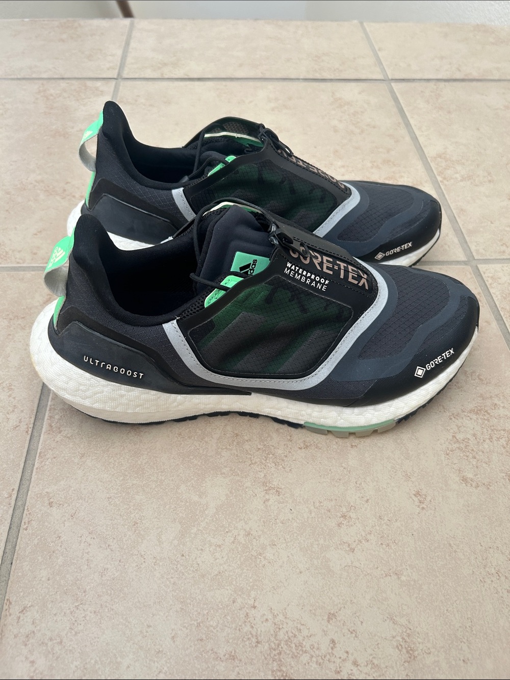 Adidas Ultraboost 22 Gore-Tex sneakers in the Carbon Beam Green colorway.